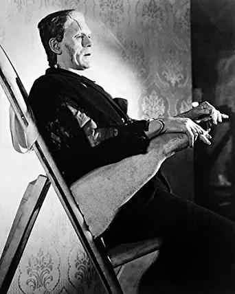 Boris Karloff 8x10 Promotional Photograph in make up chair with cigarette in Frankenstein outfit
