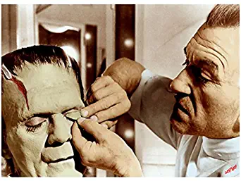 Boris Karloff having makeup applied for Frankenstein 8 x 10 Inch Photo